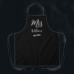 Elegant Script Mrs Last Name Newlywed Wedding Apron<br><div class="desc">Here is a potential design for an elegant script apron: "Mrs. [Last Name]" The script font is elegant and sophisticated, with a subtle flair at the ends of the letters. The "Mrs." title is written in a slightly larger size than the last name, giving it a sense of importance and...</div>