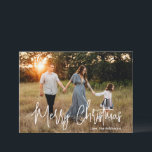 Elegant Script Photo Modern Christmas Holiday Card<br><div class="desc">Modern photo Christmas card featuring a simple and minimal design with the greeting "Merry Christmas" in an elegant white script along with your family name.  The back has a photo collage consisting of six square pictures.</div>