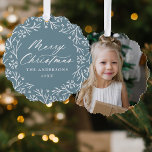 Elegant Snowflake Wreath Ice Blue Photo Christmas Ornament Card<br><div class="desc">Elegant holiday photo ornament card featuring "Merry Christmas" displayed in a white calligraphy script encircled by a wreath of snowflakes and pine branches on a frosted blue background. Personalize the front of the ornament card by adding your family name and the year. The back of the paper ornament features your...</div>