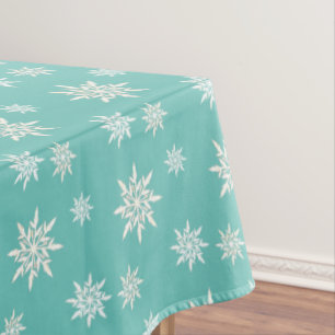 Elegant snowflakes on teal tablecloth