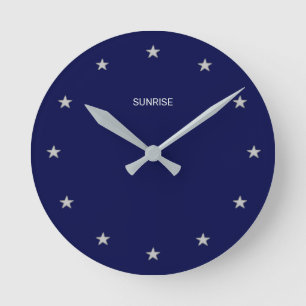 Elegant Sunrise Stars on Navy Blue Round Clock