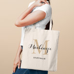 Elegant Tan Black Custom Wedding Bridesmaid Name Tote Bag<br><div class="desc">Elegant custom wedding tote bag features a personalized monogram typography design with modern calligraphy script name and serif monogram initial in neutral light tan brown and black colours. Includes custom text for a bridal party title like "BRIDESMAID" or other preferred wording.</div>