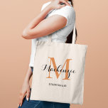 Elegant Terracotta Custom Wedding Bridesmaid Name Tote Bag<br><div class="desc">Elegant custom wedding tote bag features a personalized monogram typography design with modern calligraphy script name and serif monogram initial in terracotta dark orange and black colours. Includes custom text for a bridal party title like "BRIDESMAID" or other preferred wording.</div>