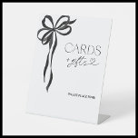 Elegant Watercolor Black Bow Cards and Gifts Pedestal Sign<br><div class="desc">Designed for the modern bride with a love for timeless elegance, this Cards & Gifts sign offers a refined way to direct guests as they arrive. Featuring a delicate hand-painted black bow and sophisticated typography, this sign subtly enhances the overall aesthetic of a bridal shower, engagement party, or wedding reception,...</div>