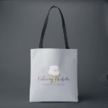 Elegant White Cake with Florals Bakery Tote Bag<br><div class="desc">An elegant white tiered cake decorated with flowers sits atop a faux gold cake stand for a beautiful aesthetic on this bakery-themed personalized tote bag. Perfect for bakers,  catering companies,  cake decorators,  or for personal use. Design © 1201AM Design Studio</div>