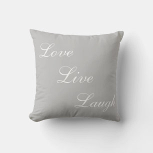 Elegant white calligraphy on light grey throw pillow