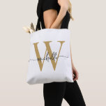 Elegant White Gold Girly Personalized Monogrammed Tote Bag<br><div class="desc">Girly Modern Simple Elegant White and Gold Monogram Initial Name Signature Script Custom Personalized Tote Bag. This design featuring your first name in a pretty hand lettered style swash tail font typography (or calligraphy) with monogram initial in gold and black on white colour background. Great feminine gift for birthday, wedding,...</div>