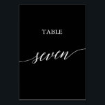 Elegant White on Black Calligraphy Table Seven Table Number<br><div class="desc">This elegant white on black calligraphy table seven table number is perfect for a simple wedding. The neutral design features a minimalist card decorated with romantic and whimsical typography. The card prints on the front and back (double-sided). Other table numbers in the collection are sold separately.</div>