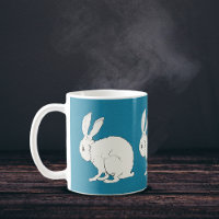 elegant white sitting bunny rabbits on blue