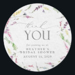 Elegant Wildflower Watercolor Floral Bridal Shower Classic Round Sticker<br><div class="desc">Pretty and elegant, this bridal shower thank you sticker features watercolor wildflower motifs in soft shades of blush pink, lilac and lavender, yellows, blues and delicate green botanical leaves, beautiful modern hand lettered calligraphy, and is easily personalized. Part of a co-ordinated suite. See full collection here: https://www.zazzle.com/collections/elegant_wildflower_watercolor_floral_bridal_shower-119635760261893795 contact designer for...</div>