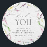 Elegant Wildflower Watercolor Floral Bridal Shower Classic Round Sticker<br><div class="desc">Pretty and elegant, this bridal shower thank you sticker features watercolor wildflower motifs in soft shades of blush pink, lilac and lavender, yellows, blues and delicate green botanical leaves, beautiful modern hand lettered calligraphy, and is easily personalized. Part of a co-ordinated suite. See full collection here: https://www.zazzle.com/collections/elegant_wildflower_watercolor_floral_bridal_shower-119635760261893795 contact designer for...</div>