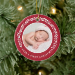 Elegant Wreath Baby's First Christmas | Photo Ceramic Ornament<br><div class="desc">Create a special keepsake for baby's very first Christmas with this stylish photo ornament!  It features a pretty laurel wreath in white surrounding the circle shaped photo template. Text templates are included on the back for baby's name and the year.</div>