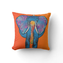 Éléphant coloré avec rouge/orange sur le coussin