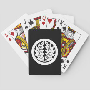 Embracing holly leaves in circle playing cards