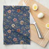 Embroidered plain wildflowers on denim background