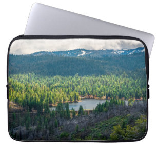 Emerald Basin Beneath Mountain Clouds Laptop Sleeve