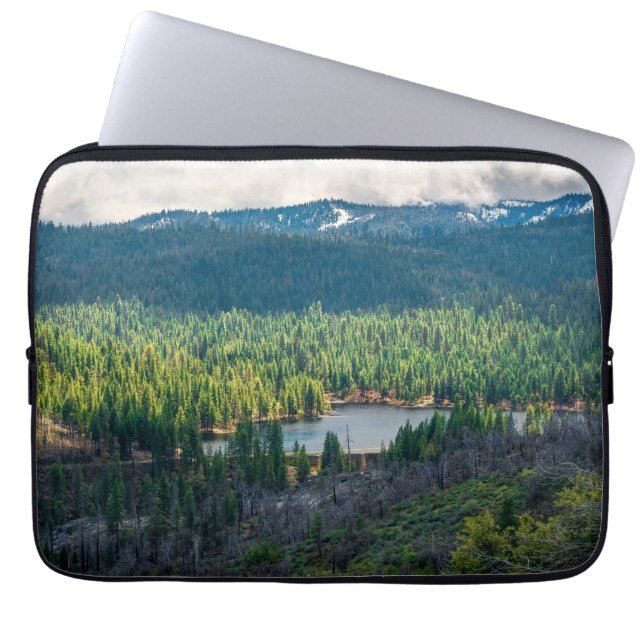 Emerald Basin Beneath Mountain Clouds Laptop Sleeve (Front)