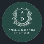 Emerald Green Crest Modern Monogram Wedding  Classic Round Sticker<br><div class="desc">Add a touch of luxury to your wedding with the Emerald Green Crest Modern Monogram Wedding Classic Round Sticker. Featuring a rich emerald green background, a refined crest design, and a personalized monogram, this sticker is perfect for enhancing your wedding invitations, favours, or decor. Its elegant and timeless style makes...</div>