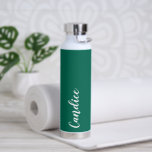 Emerald Green Personalized Wedding Bridesmaid Water Bottle<br><div class="desc">Gift your wedding bridesmaid or maid of honour with this trendy, vacuum Insulated water bottle that features her name in white, stylized script on an emerald green colour background designed to match your wedding colour scheme. Personalize bottle by editing and replacing name with your own as desired. Select your water...</div>