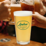 Emerald Green Stylized Wedding Groomsman Name Glass<br><div class="desc">Beer glass for the wedding groomsman that features his name printed in a trendy, emerald green colour, stylized script inside an emerald green, oval border along with wedding date. A great party supply idea for a bachelor party! Personalize your beer glass by editing and replacing name and date with your...</div>