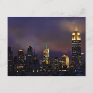 Emp St Bldg glows in clouds and fog Postcard