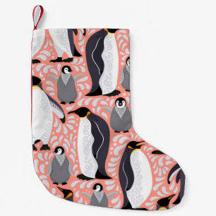 Emperor penguins and their cubs on a pink patterne small christmas stocking