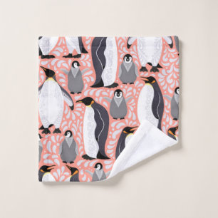 Emperor penguins and their cubs on a pink patterne wash cloth