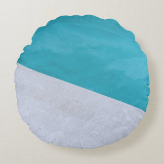 Empty gray floor beside pool round pillow