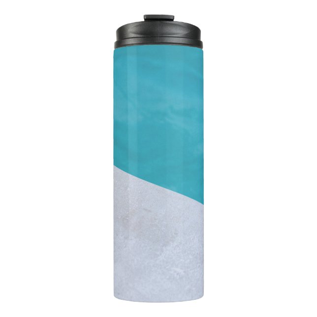 Empty grey floor beside pool thermal tumbler (Front)