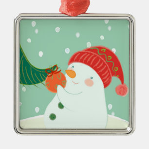 En Métal Un bonhomme de neige accrochant un ornement sur un