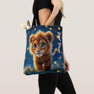 Enchanted blue-eyed lion cub in firefly glow tote bag