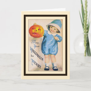 Enfant avec carte de citrouille d'Halloween