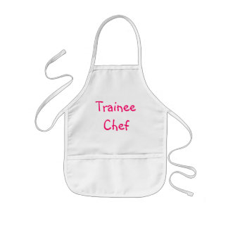 Enfant Le chef de stagiaire badine le tablier