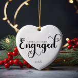 Engaged Personalize Engagement Gift For Christmas Ceramic Ornament<br><div class="desc">Celebrate a momentous occasion with our Engaged Personalized Engagement Gift For Christmas Ceramic Ornament, designed to capture the beauty of your first Christmas together as an engaged couple. This ornament features an elegant, minimalist design in classic black and white, perfect for those who appreciate a clean and simple aesthetic. Whether...</div>