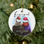 Engaged Script Watercolor Couple and Names Ceramic Ornament<br><div class="desc">Engaged,  personalized christmas tree ornament. This watercolor design has a trendy illustration of a couple wearing santa hats. "Engaged" is hand lettered in modern script and the template is ready for you to add your names and the year. Double sided with the same design on both sides.</div>