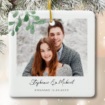 Engagement Photo Christmas Ceramic Ornament<br><div class="desc">This Engagement Christmas Ornament is decorated with watercolor mistletoe and stylish script typography. Easily customizable with your photo, name, and year. Use the Design Tool to change the text size, style, or colour. Because we create our artwork you won't find this exact image from other designers. Original Watercolor © Michele...</div>