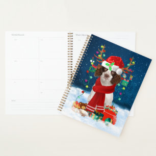 English Springer Spaniel dog with Christmas gifts Planner