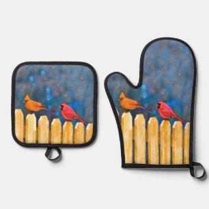 Ensemble De Gant De Cuisine Et De Manique Cardinaux sur la clôture dans la peinture d'hiver