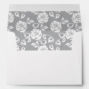 Enveloppes motif en dentelle blanche sur arrière - plan gris