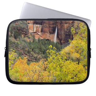 Ephemeral waterfall pours out of slot in cliff laptop sleeve