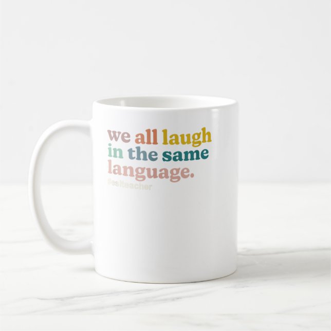 ESL Teacher We All Laugh in the Same Language. Col Coffee Mug (Left)
