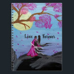 Eternal love under cherry blossom spiral notebook<br><div class="desc">Immerse yourself in the captivating beauty of our "Eternal Love Under Cherry Blossom" spiral notebook. This artistic design, bathed in the soft glow of a full moon and surrounded by delicate pink petals, celebrates enduring affection and natural grace. Ideal for notes, ideas, or simply adorning your desk with a touch...</div>