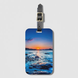 Étiquette À Bagage Lever de soleil au-dessus d'horizon au bord de la
