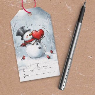 Étiquette cadeau de bonhomme de neige avec un gran