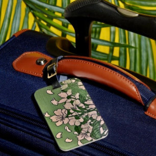 Étiquette de bagage verte à fleurs roses