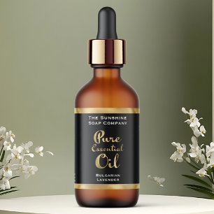 Étiquette de bouteille d'huile essentielle noire e