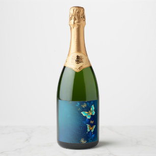 Étiquettes Pour Bouteilles De Vin Mousseux Papillons d'or sur un Arrière - plan bleu