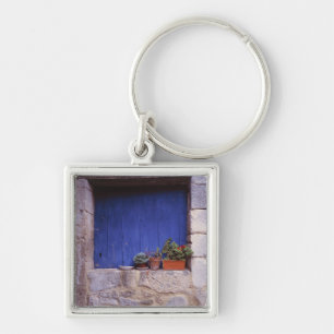 Europe, France, Cereste. A blue door adds colour Keychain