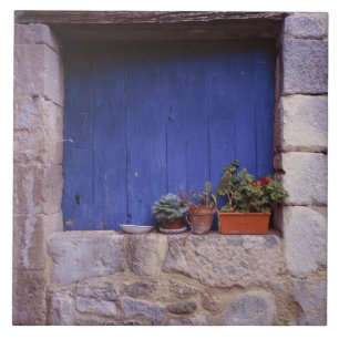 Europe, France, Cereste. A blue door adds colour Tile