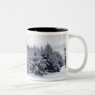 Evergreen trees and road in snow Two-Tone coffee mug